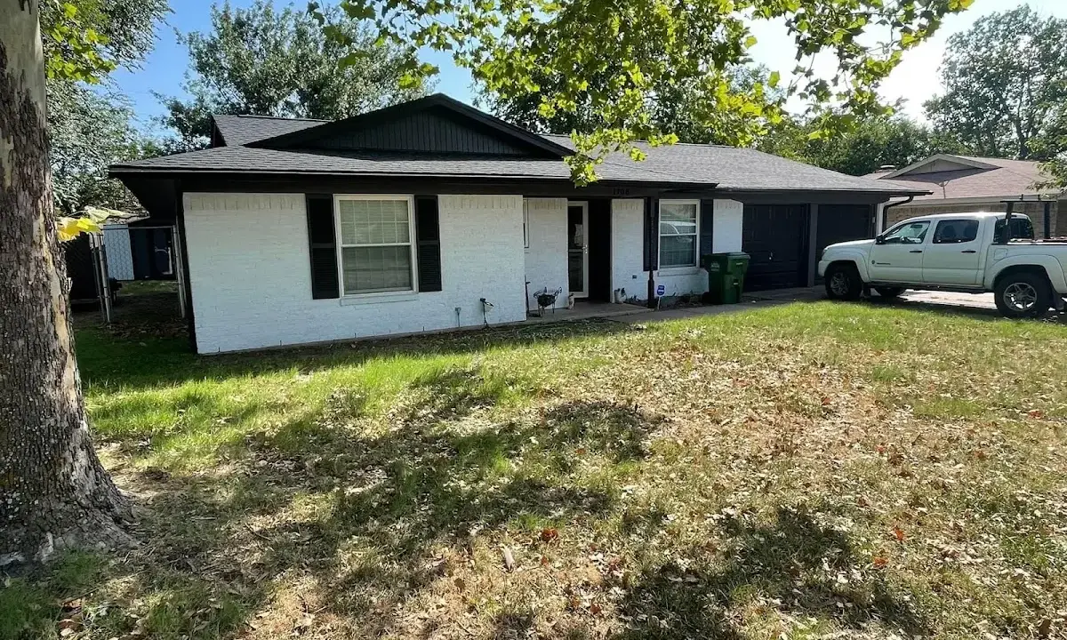 Professional roofing crew working on a residential roof in Odessa
